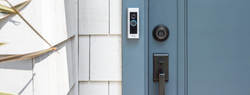 A blue door with a Ring video doorbell